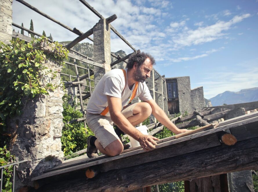 man repairing his roof