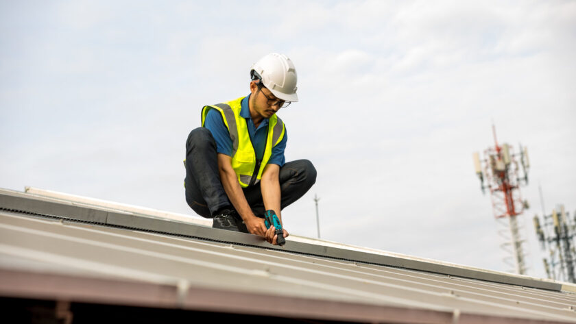 man fixing the roof