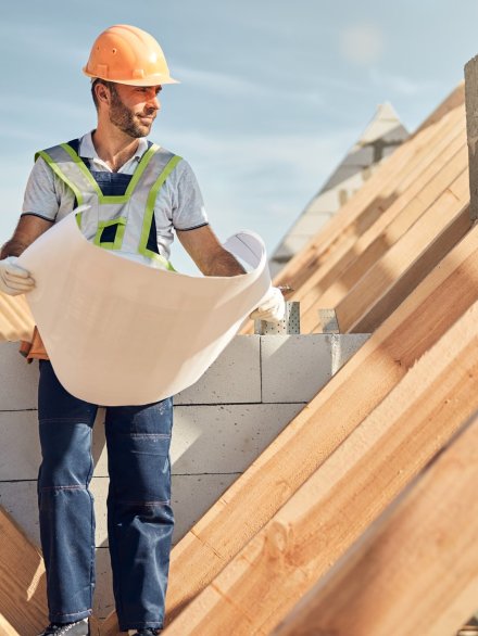 satisfied-construction-site-worker-checking-the-bl-2024-10-21-01-56-45-utc San Diego Commercial Roofing
